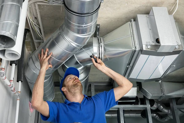 depositphotos_475779766-stock-photo-hvac-services-worker-install-ducted